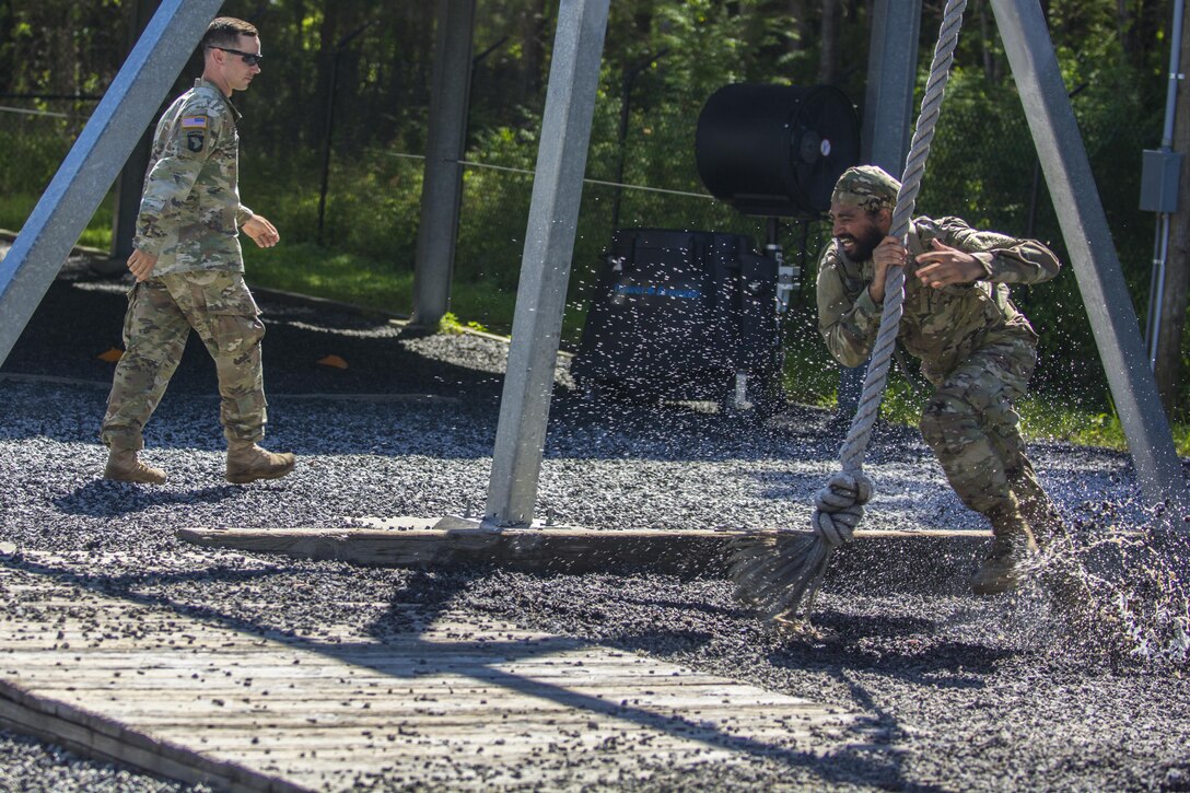 Before tackling the 40-foot wall at Victory Tower, Soldiers in Basic Combat Training with Co. A, 2nd Bn., 13th Inf. Reg. at Fort Jackson, S.C., practice swinging across their drill sergeant's lava pit on the ground, June 8. Sometimes they make it, sometimes they don't. (U.S. Army photo by Sgt. 1st Class Brian Hamilton/ released)