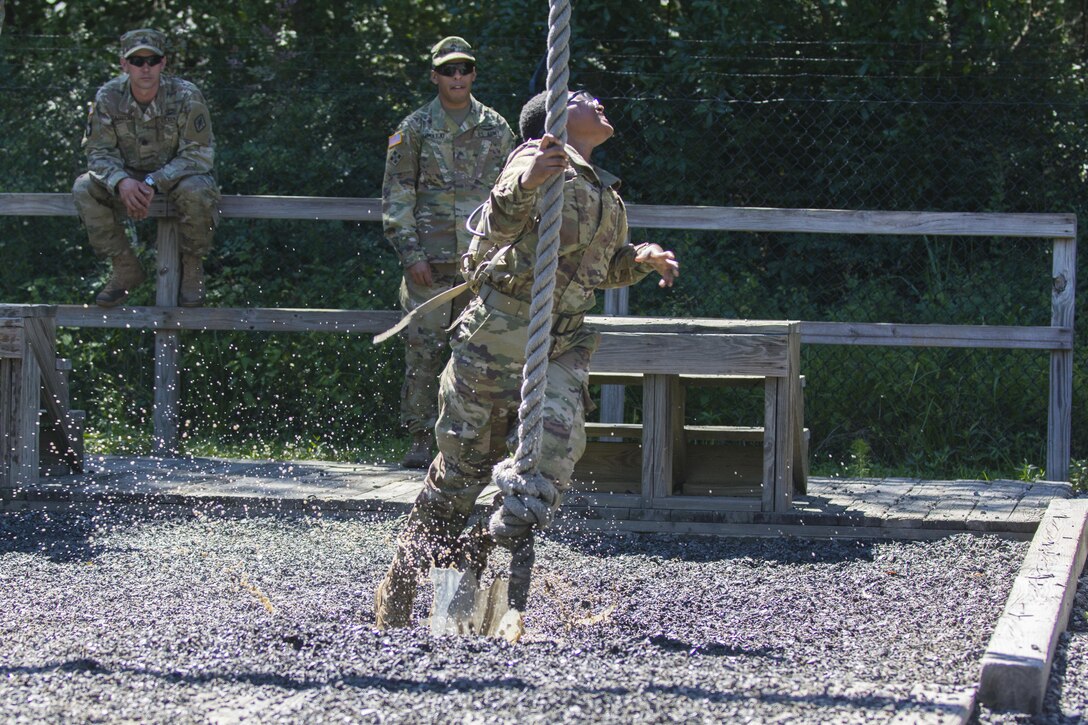 Before tackling the 40-foot wall at Victory Tower, Soldiers in Basic Combat Training with Co. A, 2nd Bn., 13th Inf. Reg. at Fort Jackson, S.C., practice swinging across their drill sergeant's lava pit on the ground, June 8. Sometimes they make it, sometimes they don't. (U.S. Army photo by Sgt. 1st Class Brian Hamilton/ released)