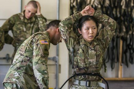 A Soldier in Basic Combat Training with Co. A, 2nd Bn. 13th Inf. Reg. gets her swiss seat tied by the cadre at Victory Tower on Fort Jackson, S.C., June 8. (U.S. Army photo by Sgt. 1st Class Brian Hamilton/ released)