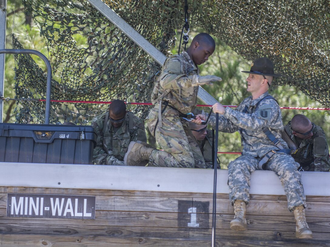 Drill Sergeants with Co. A, 2nd Bn., 13th Inf. Reg., at Fort Jackson, S.C., hook up Soldiers to the repel line at the 20-foot mini-wall, June 8. (U.S. Army photo by Sgt. 1st Class Brian Hamilton/ released)