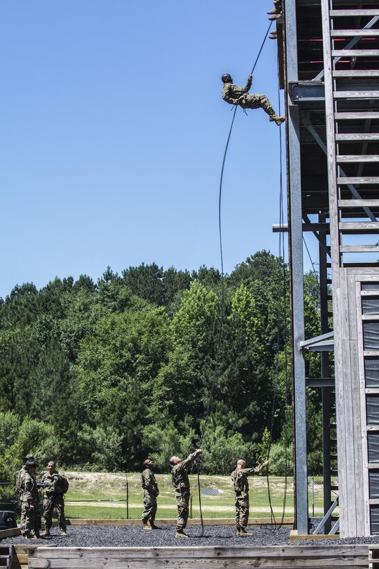 Having conquered the mini wall at Victory Tower on Fort Jackson, S.C., Soldiers in Basic Combat Training with Co. A, 2nd Bn., 13th Inf. Reg., repel down the 40-foot wall at the main tower, June 8. (U.S. Army photo by Sgt. 1st Class Brian Hamilton/ released)