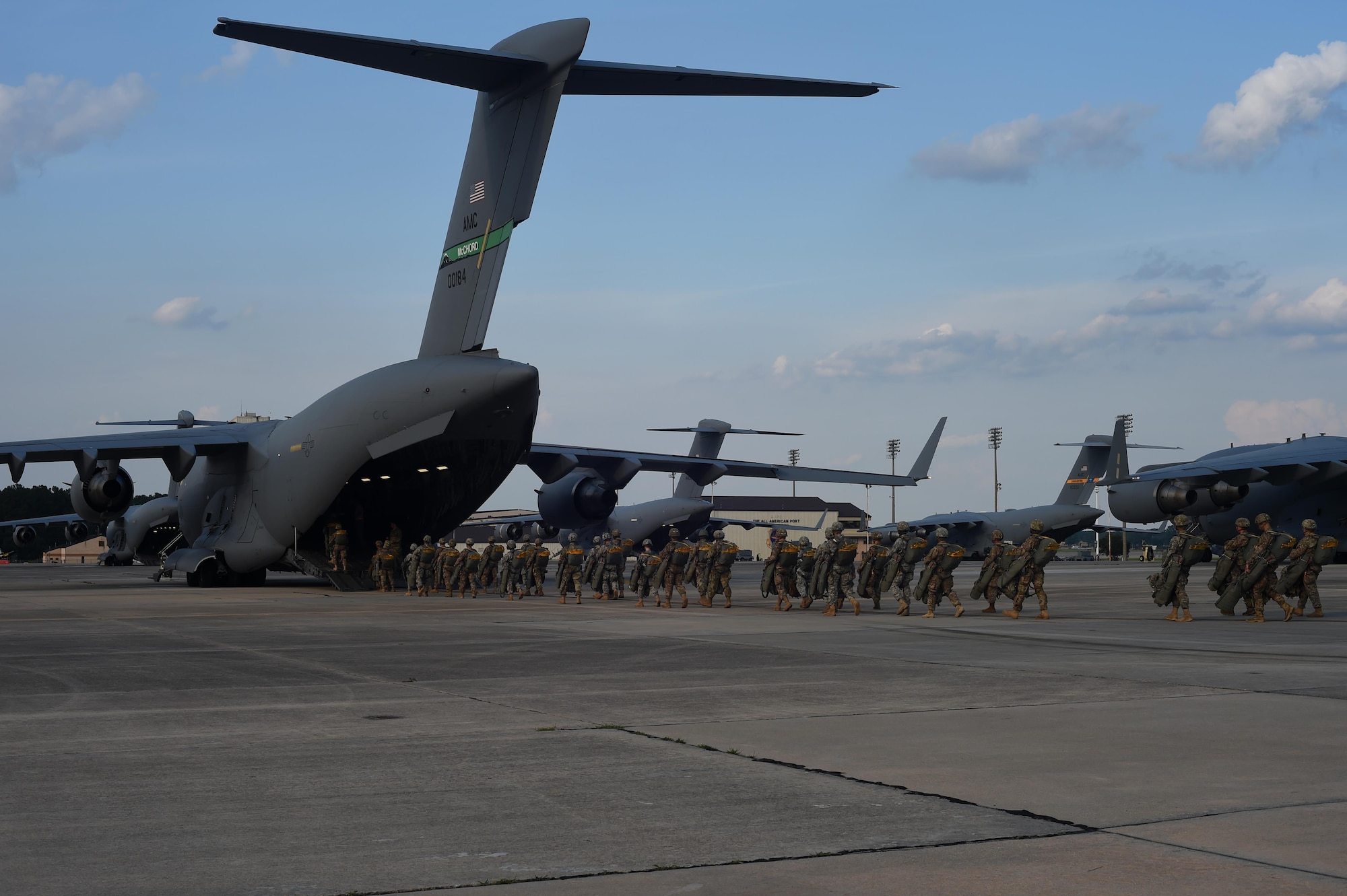 82nd Airborne Division Soldiers load into a 62nd Airlift Wing C-17 Globemaster III at Pope Army Air Field, North Carolina, June 4, 2016. Three McChord C-17’s and four C-17’s from Joint Base Charleston, South Carolina, air dropped more than 600 Army Soldiers over the range for training. (U.S. Air Force photo/Staff Sgt. Naomi Shipley)
