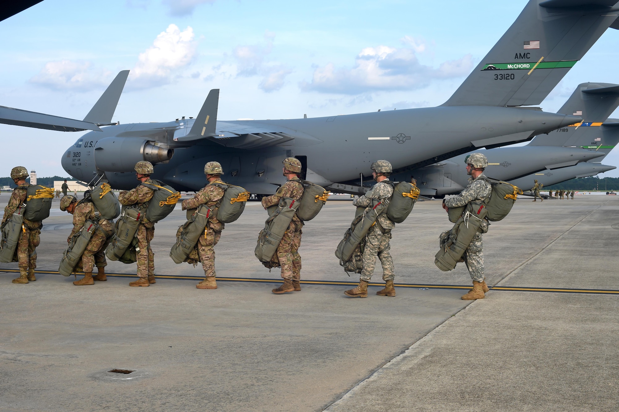 82nd Airborne Division Soldiers load into a 62nd Airlift Wing C-17 Globemaster III prior to a static line jump at Pope Army Air Field, North Carolina, June 4, 2016. Three McChord C-17’s met up with four Joint Base Charleston, South Carolina, C-17’s to conduct the personnel air drop for training prior to departing for Europe to participate in a multi-national exercise, known as Swift Response (U.S. Air Force photo/Staff Sgt. Naomi Shipley)