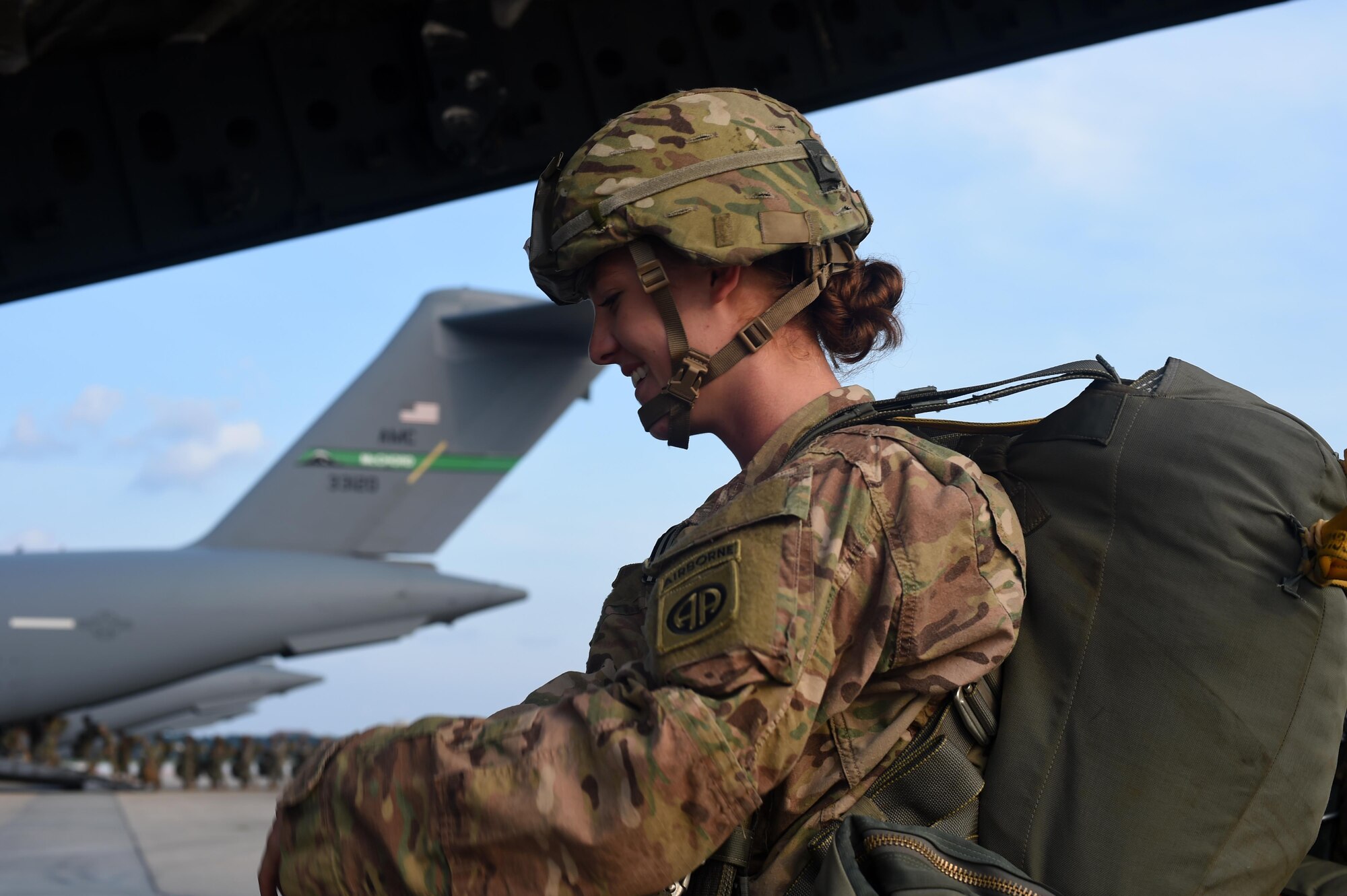 An 82nd Airborne Division Soldier boards a C-17 Globemaster III at Pope Army Air Field, North Carolina, June 4, 2016. Hundreds of Soldiers with the 82nd Airborne Division conducted a static line jump out of seven C-17s including three from Joint Base Lewis-McChord, Washington and from Joint Base Charleston, S.C. (U.S. Air Force photo/ Staff Sgt. Naomi Shipley)