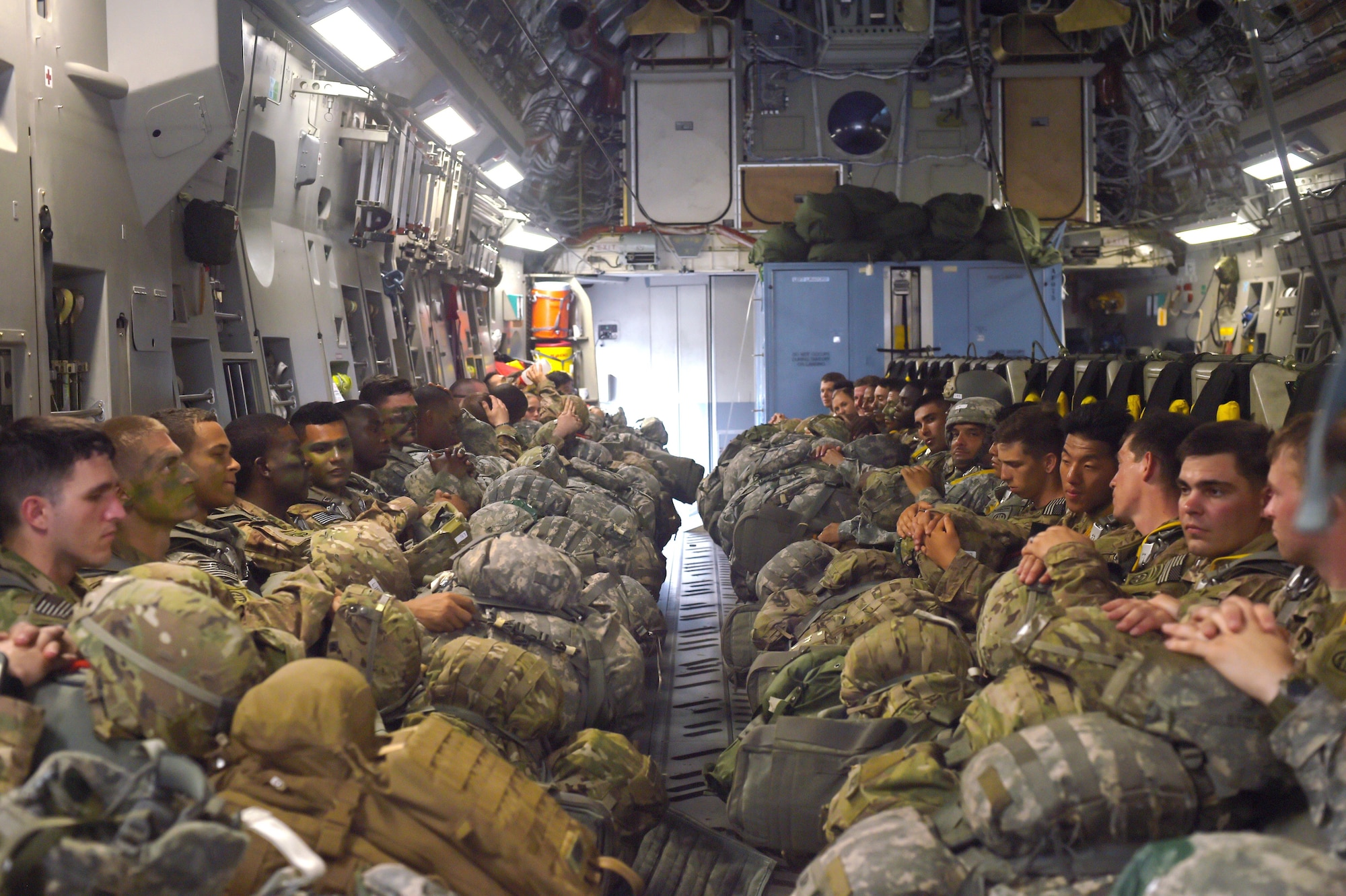 Soldiers with the 82nd Airborne Division sit inside a 62nd Airlift Wing C-17 Globemaster III at Pope Army Air Field, North Carolina, June 4, 2016. More than 90 Soldiers boarded the C-17 to conduct a static line parachute jump over the range. (U.S. Air Force photo/Staff Sgt. Naomi Shipley)