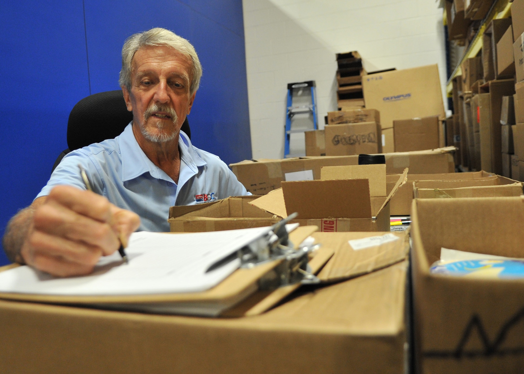 Donald Roth, a receiving clerk at the Tyndall AFB Base Supply Center, performs a supplies in-check June 6 at the supply center. Roth has dedicated 45 years to the Air Force, working as a civilian employee, contractor and Air Force veteran. (U.S. Air Force photo by Senior Airman Ty-Rico Lea/Released)