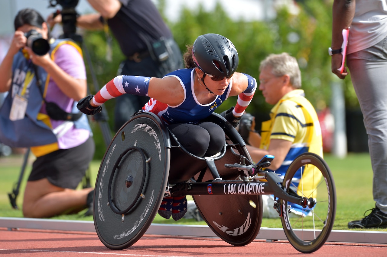 Army Capt. Kelly Elmlinger competes in the 100-meter women's track and field final during the 2016 Invictus Games in Orlando, Fla., May 10, 2016. The Invictus Games are an adaptive sports competition. More than 500 military competitors from 14 nations took part in 10 sporting events at this year’s games. Elmlinger will participate in the upcoming Department of Defense Warrior Games. Army photo by Staff Sgt. Alex Manne