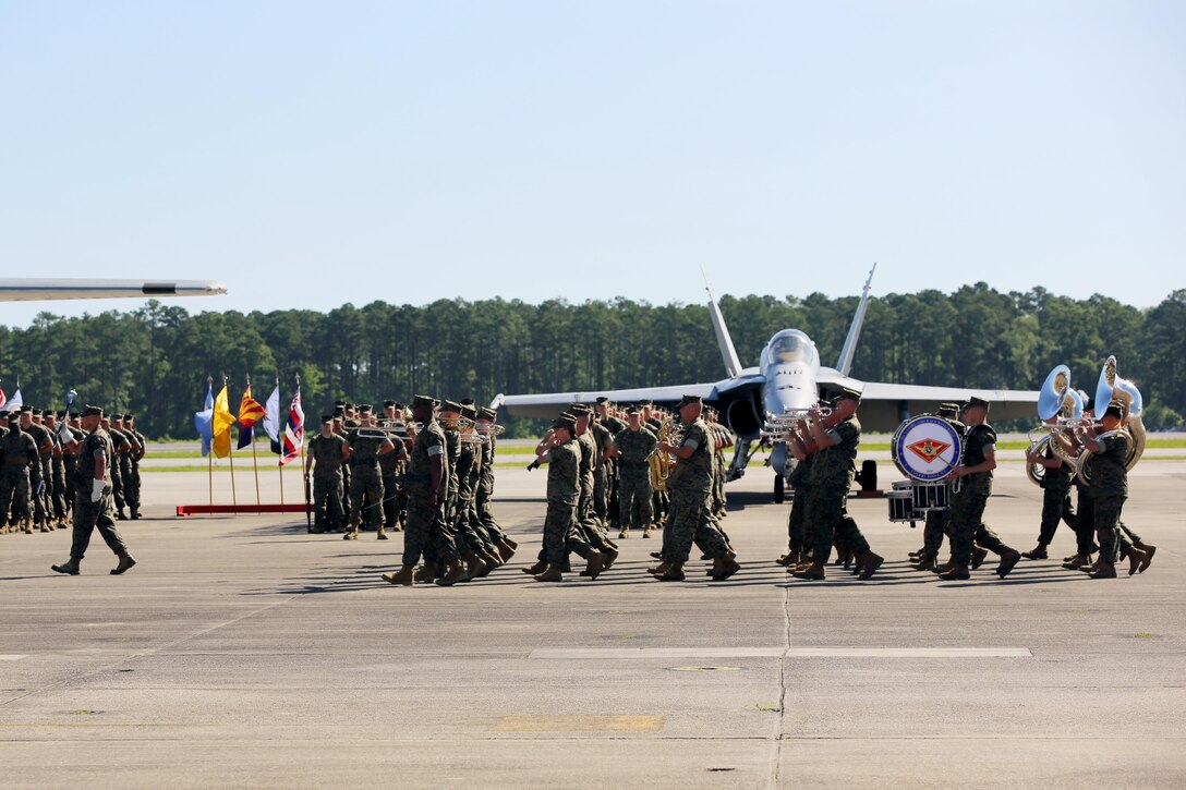 The 2nd Marine Aircraft Wing Band performs during the 2nd Marine Aircraft Wing change of command ceremony at Marine Corps Air Station Cherry Point, N.C., June 9, 2016. Maj. Gen. Gary L. Thomas relinquished his post as the 2nd MAW commanding general to Brig. Gen. Matthew G. Glavy during the ceremony. (U.S. Marine Corps photo by Lance Cpl. Mackenzie Gibson/Released)