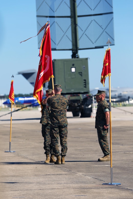 Maj. Gen. Gary L. Thomas passes the 2nd Marine Aircraft Wing colors to Brig. Gen. Matthew G. Glavy during the 2nd MAW change of command ceremony at Marine Corps Air Station Cherry Point, N.C., June 9, 2016. Thomas relinquished his post as 2nd MAW commanding general to Glavy during the ceremony. (U.S. Marine Corps photo by Lance Cpl. Mackenzie Gibson/Released)