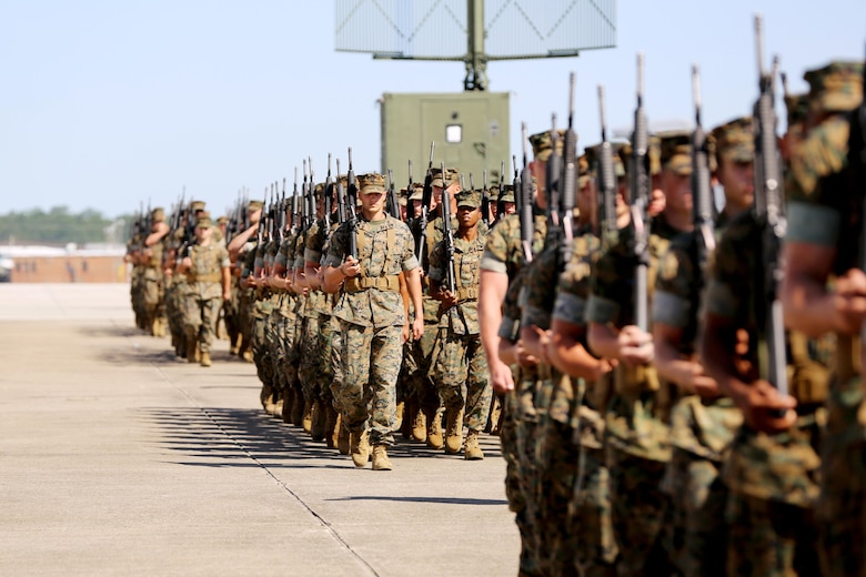 Marines with the 2nd Marine Aircraft Wing perform a pass-in-review for new commanding general, Brig. Gen. Matthew G. Glavy, during the 2nd MAW change of command ceremony at Marine Corps Air Station Cherry Point, N.C., June 9, 2016. Maj. Gen. Gary L. Thomas relinquished his post as the 2nd MAW commanding general to Glavy during the ceremony. (U.S. Marine Corps photo by Lance Cpl. Mackenzie Gibson/Released)