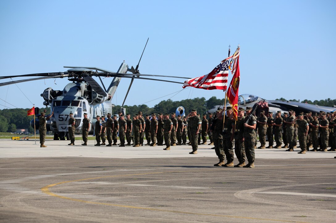 Marines with the 2nd Marine Aircraft Wing perform a pass-in-review for their new commanding general during the 2nd MAW change of command ceremony at Marine Corps Air Station Cherry Point, N.C., June 9, 2016. Maj. Gen. Gary L. Thomas relinquished his post as the 2nd MAW commanding general to Brig. Gen. Matthew G. Glavy during the ceremony. (U.S. Marine Corps photo by Cpl. N. W. Huertas/Released)