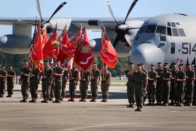 2nd Marine Aircraft Wing Marines salute the colors while the National Anthem is played during the 2nd MAW change of command ceremony at Marine Corps Air Station Cherry Point, N.C., June 9, 2016. Maj. Gen. Gary L. Thomas relinquished his post as the 2nd MAW commanding general to Brig. Gen. Matthew G. Glavy during the ceremony. (U.S. Marine Corps photo by Cpl. N. W. Huertas/Released)