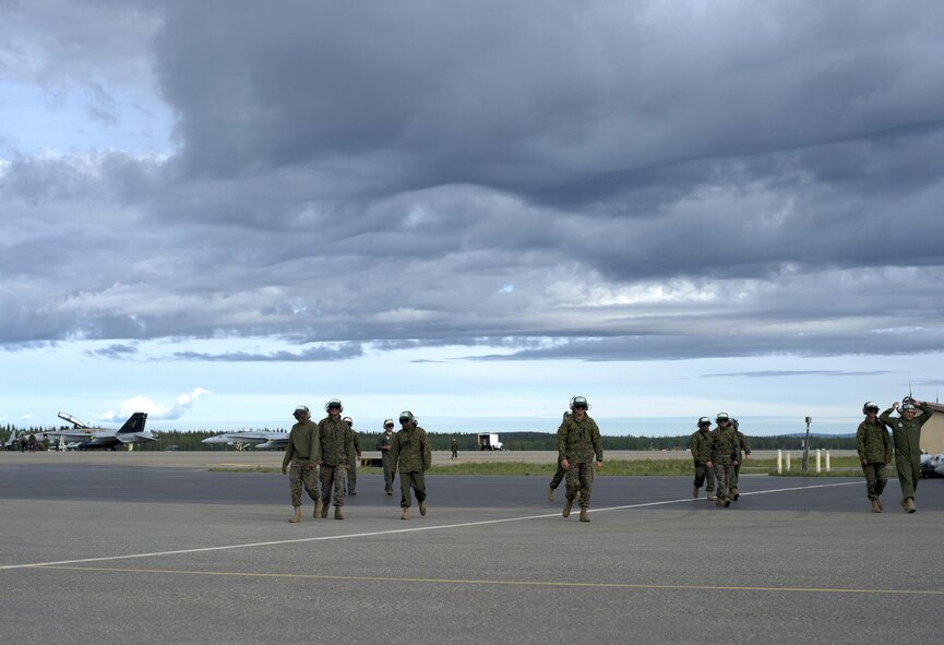 U.S. Marine Corps Marines assigned to the Fixed Marine All-Weather Fighter Attack Squadron 242, Marine Corps Air Station Iwakuni, Japan, after ensuring jets safely took off, June 7, 2016, during Red Flag-Alaska (16-2), Eielson Air Force Base, Alaska. RF-A provides training for deployed maintenance and support personnel in sustainment of large-force deployed air operations. (U.S. Air Force photo by Airman Isaac Johnson)