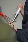 Republic of Singapore Air Force (RSAF) ME1 Liew Liqiang, a 425th Aircraft Maintenance Unit (AMU) weapons load technician assigned to Luke Air Force Base, Ariz., secures the computer control group to a GBU-12 Paveway II laser-guided bomb prior to an afternoon sortie June 7, 2016, on the Eielson Air Force Base, Alaska flight line. The 425th AMU is an essential part of a cooperative partnership between the U.S. Air Force and the RSAF, demonstrating the United States’ commitment to partner nations in the Indo-Asia-Pacific. (U.S. Air Force photo by Capt. Elias Zani/Released)