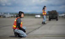 Republic of Singapore Air Force (RSAF) maintainers assigned to Luke Air Force Base, Ariz., wait to marshal incoming RSAF F-16 Fighting Falcons after a RED FLAG-Alaska (RF-A) 16-2 morning sortie June 7, 2016, on the Eielson Air Force Base, Alaska, flight line. RF-A is a Pacific Air Forces commander-directed field training exercise for U.S. and allied forces, to provide joint offensive counter-air, interdiction, close air support and large force employment training in a simulated combat environment. (U.S. Air Force photo by Capt. Elias Zani/Released)