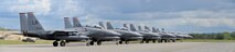 A row of U.S. Air Force F-15E Strike Eagle all-weather, highly maneuverable, dual-role fighter aircraft assigned to the 494th Fighter Squadron out of Royal Air Force Lakenheath, England, wait for their turn to launch for an afternoon sortie out of Eielson Air Force Base, Alaska, June 6, 2016, during RED FLAG-Alaska (RF-A) 16-2. RF-A is a series of Pacific Air Forces commander-directed field training exercises for U.S. and partner nation forces like the Liberty Wing, enabling joint and international units to sharpen their combat skills by flying simulated combat sorties in a realistic threat environment inside the Joint Pacific Alaska Range Complex, the largest instrumented air, ground and electronic combat training range in the world. (U.S. Air Force photo illustration by Master Sgt. Karen J. Tomasik/Released)