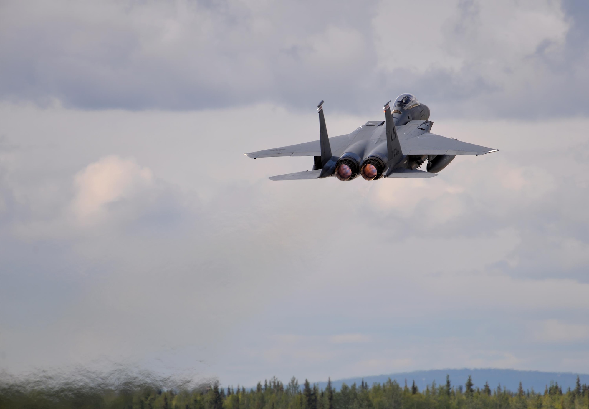 A U.S. Air Force F-15E Strike Eagle all-weather, highly maneuverable, dual-role fighter assigned to the 494th Fighter Squadron out of Royal Air Force Lakenheath, England, takes off from Eielson Air Force Base, Alaska, June 6, 2016, during RED FLAG-Alaska (RF-A) 16-2. The Joint Pacific Alaska Range Complex, where RF-A simulated aerial combat missions are conducted, provides a realistic training environment and allows commanders to train for full spectrum engagements, ranging from individual skills to complex, large-scale joint engagements. Conducting RED FLAG training in Alaska signifies the United States' continued commitment to the Indio-Asia-Pacific region. (U.S. Air Force photo by Master Sgt. Karen J. Tomasik/Released)