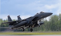A U.S. Air Force F-15E Strike Eagle all-weather, highly maneuverable, dual-role fighter assigned to the 494th Fighter Squadron out of Royal Air Force Lakenheath, England, gains speed as it lifts off from the Eielson Air Force Base, Alaska, runway June 6, 2016, during RED FLAG-Alaska (RF-A) 16-2. RF-A missions are conducted over the Joint Pacific Alaska Range Complex, more than 67,000 square miles of airspace that includes one conventional bombing range and two tactical bombing ranges containing 510 different types of targets and 45 threat simulators, providing units like the Liberty Wing a realistic training environment in the largest instrumented air, ground and electronic combat training range in the world. (U.S. Air Force photo by Master Sgt. Karen J. Tomasik/Released)
