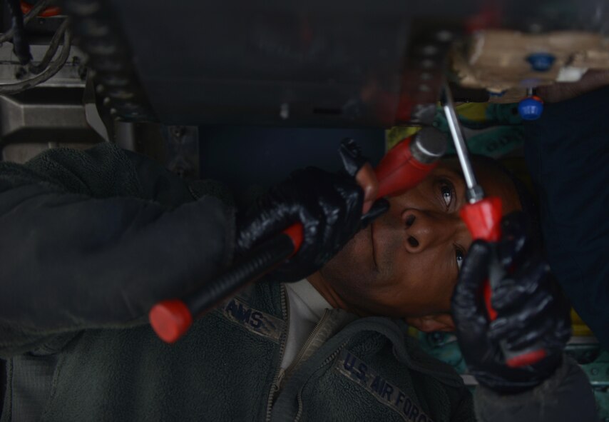 U.S. Air Force Staff Sgt. Jarvis Williams, a crew chief assigned to the 494th Aircraft Maintenance Unit out of Royal Air Force Lakenheath, England, works to remove an airframe mounted accessory drive from an F-15E Strike Eagle dual-role fighter aircraft June 8, 2016, during RED FLAG-Alaska (RF-A) 16-2 at Eielson Air Force Base, Alaska. Crew chiefs assigned to RF-A must learn to operate quickly in a high-operations tempo simulated combat environment without compromising safety. (U.S. Air Force photo by Airman Isaac Johnson)