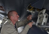 U.S. Air Force Airman 1st Class Zachary Suttles, a crew chief assigned to the 494th Aircraft Maintenance Unit out of Royal Air Force Lakenheath, England, performs maintenance on an F-15E Strike Eagle dual-role fighter aircraft June 8, 2016, during RED FLAG-Alaska (RF-A) 16-2 at Eielson Air Force Base, Alaska. RF-A is a Pacific Air Forces commander-directed field training exercise for U.S. and allied forces, providing joint offensive counter-air, interdiction, close air support, and large force employment training in a simulated combat environment. (U.S. Air Force photo by Airman Isaac Johnson)
