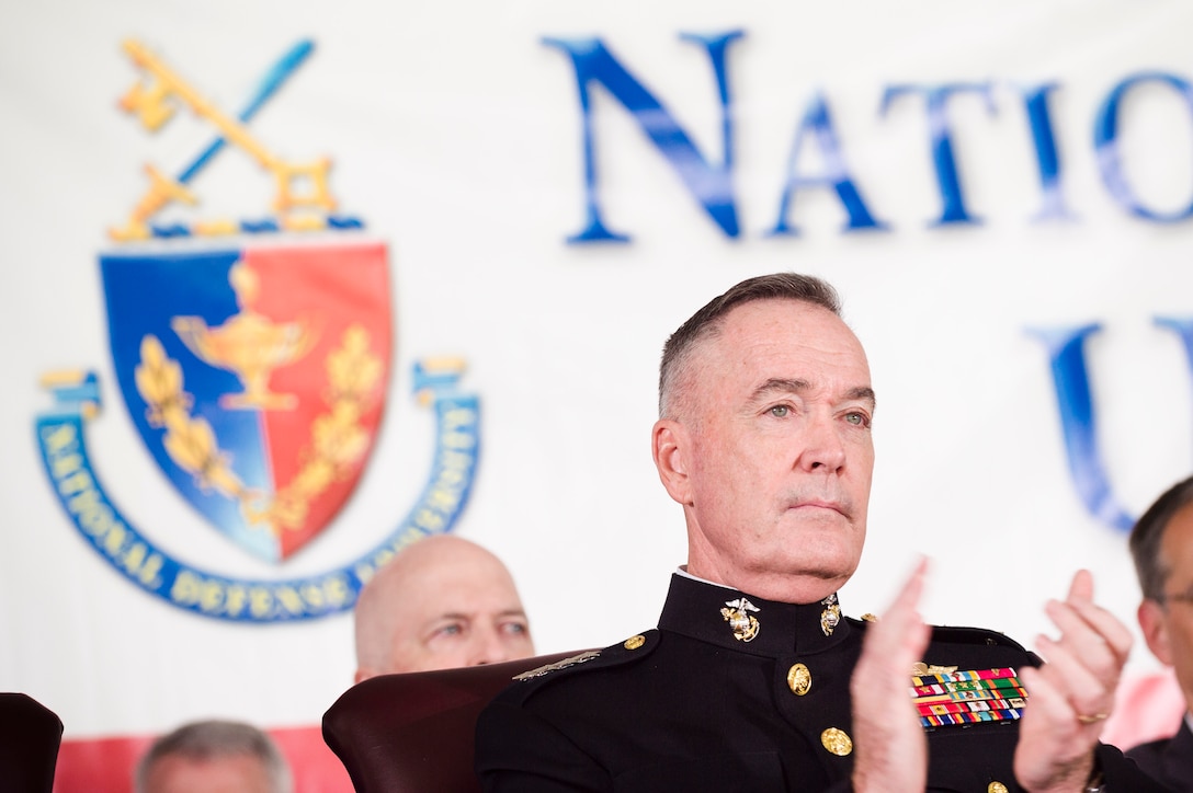 Marine Corps Gen. Joe Dunford, chairman of the Joint Chiefs of Staff, applauds during the National Defense University's 2016 graduation ceremony at Fort Lesley J. McNair in Washington, D.C., June 9, 2016. The university provides military education to senior leaders. DoD photo by Army Staff Sgt. Sean K. Harp
