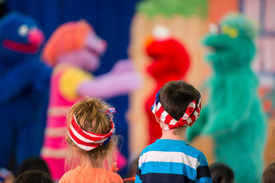 Members of Travis Air Force Base, Calif., enjoy the performance of the Sesame Street USO Experience for Military Families at the base gym June 6, 2016. (U.S. Air Force photo by Louis Briscese/Released)   