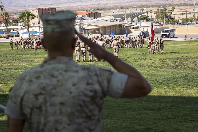 Sgt. Maj. Avery Crespin, battalion sergeant major, Headquarters Battalion, salutes the colors during the playing of the national anthem as part of the battalion’s change of command ceremony at Lance Cpl. Torrey L. Gray Field aboard the Marine Corps Air Ground Combat Center Twentynine Palms, Calif., June 8, 2016. During the ceremony, Lt. Col. Dennis A. Sanchez, outgoing battalion commander, relinquished command of Headquarters Battalion to Lt. Col. Michael Cable, oncoming battalion commander. (Official Marine Corps photo by Lance Cpl. Levi Schultz/Released)
