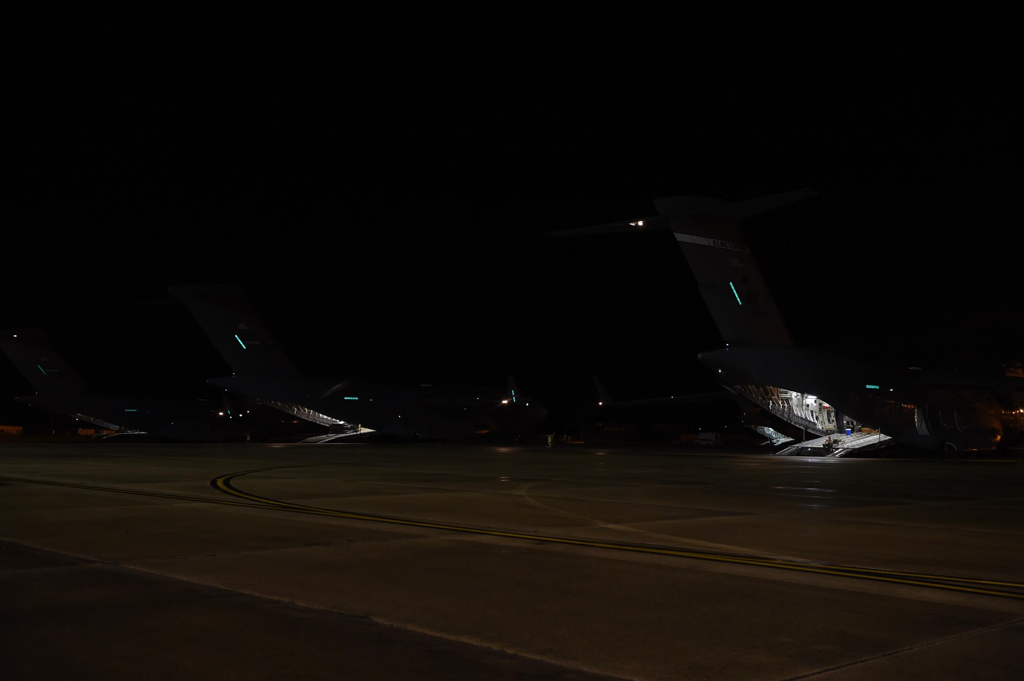 C-17 Globemaster III aircrafts from Joint Base Lewis-McChord, Wash., and Joint Base Elmendorf, Alaska, prepare to leave from Pope Army Air Field, N.C., June 6, 2016, for Exercise Swift Response 2016. Multiple aircrews flew in formation to Poland to deliver rapid air mobility for the multi-national exercise in Europe. (Air Force photo/Staff Sgt. Naomi Shipley)