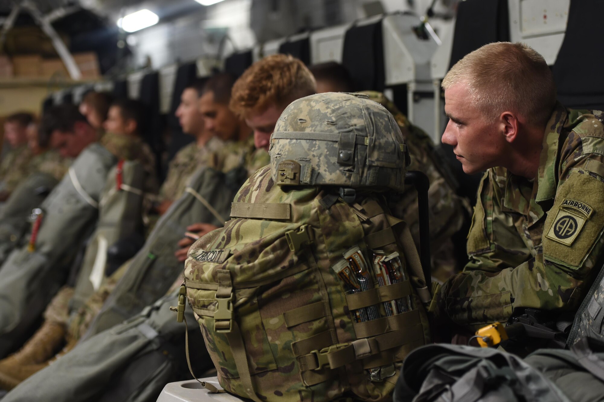 Army SPC. Dakota Truscott, 82nd Airborne Division sits on a 62nd Airlift Wing C-17 Globemaster III at Pope Army Air Field, N.C., on June 6, 2016. The 62 AW provided three C-17’s to conduct equipment and personnel air drops in Poland for Exercise Swift Response 2016. (Air Force photo/Staff Sgt. Naomi Shipley)
