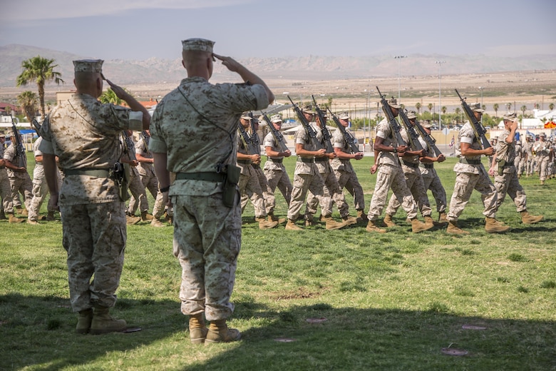 Lt. Col. Dennis A. Sanchez, left, outgoing battalion commander, Headquarters Battalion, and Lt. Col. Michael Cable, right, oncoming battalion commander, Headquarters Battalion, salute Headquarters Battalion Marines during pass in review as part of the battalion’s change of command ceremony at Lance Cpl. Torrey L. Gray Field aboard the Marine Corps Air Ground Combat Center Twentynine Palms, Calif., June 8, 2016. During the ceremony, Sanchez relinquished command of Headquarters Battalion to Cable. (Official Marine Corps photo by Lance Cpl. Levi Schultz/Released)