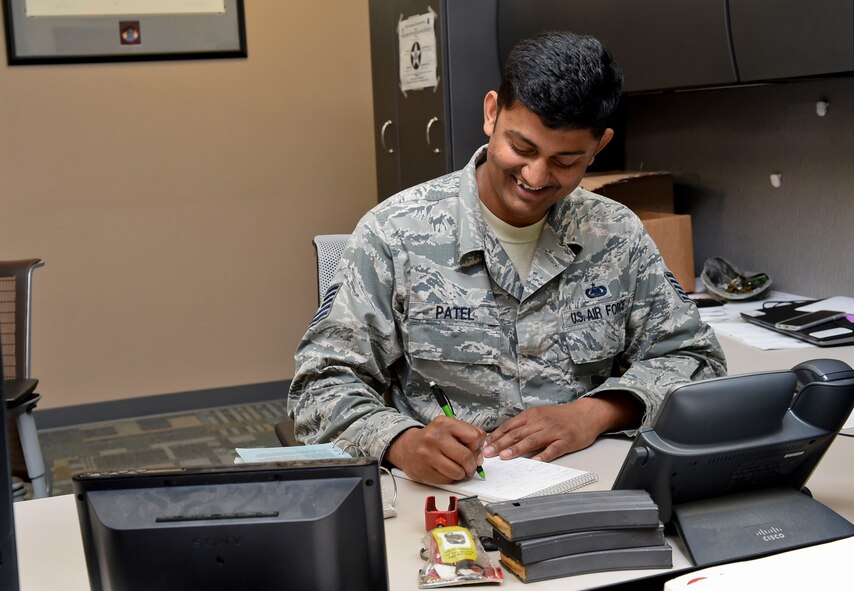 Tech. Sgt. Jignesh Patel, 821st Contingency Response Squadron unit equipment monitor, goes through M-16 magazines and blank-firing adaptors at Travis Air Force Base, Calif., June 7, 2016. Patel oversees all the equipment for the 821st CRS and when they are tasked with an assignment, he ensures the equipment they are taking is accounted for and serviceable. (U.S. Air Force photo by Staff Sgt. Robert Hicks)
