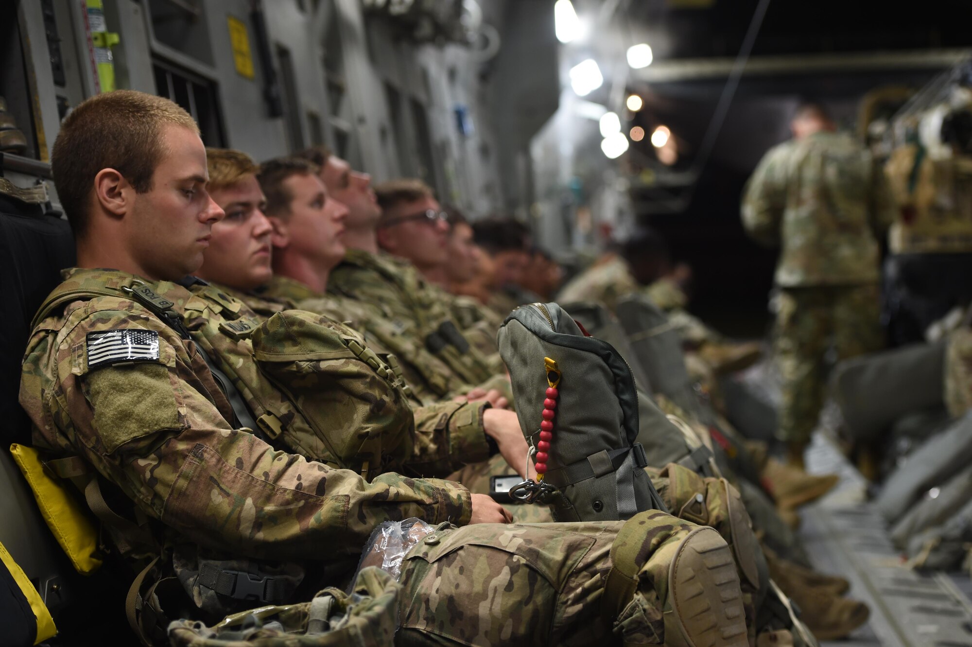 An 82nd Airborne Division Paratrooper sits inside a 62nd Airlift Wing C-17 Globemaster III at Pope Army Air Field, N.C., on June 6, 2016. More than 500 Paratroopers in total were air dropped into Poland where they conducted training on the ground during Exercise Swift Response 2016. (Air Force photo/Staff Sgt. Naomi Shipley)
 

