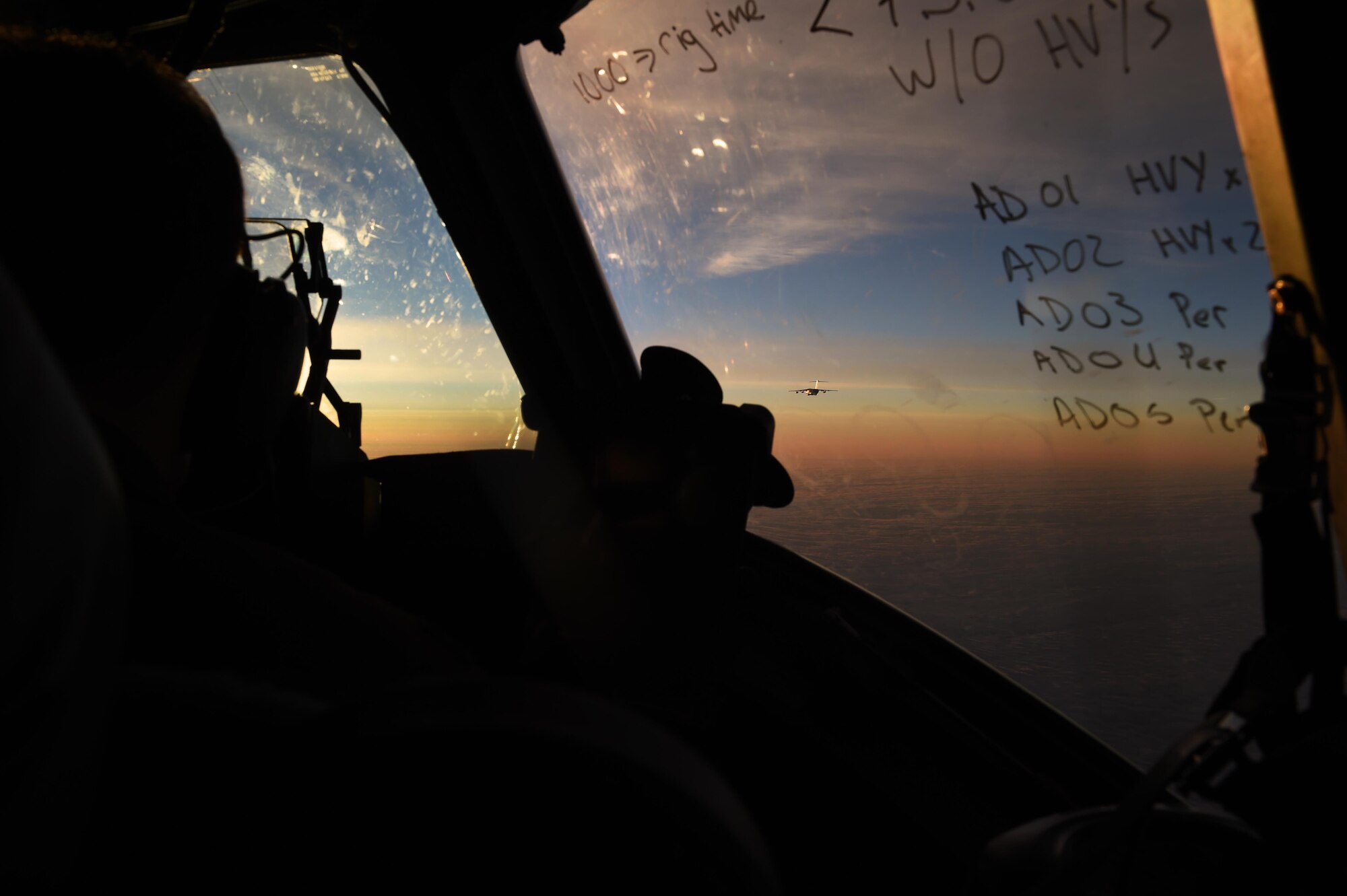 A 62nd Airlift Wing C-17 Globmaster III flies during sunrise over the Atlantic Ocean on a more than 4,000 mile mission to Poland on June 6, 2016. Three McChord C-17 air crews journeyed to Poland to participate in Exercise Swift Response 2016 by delivering Rapid Air Mobility. (Air Force photo/Staff Sgt. Naomi Shipley)