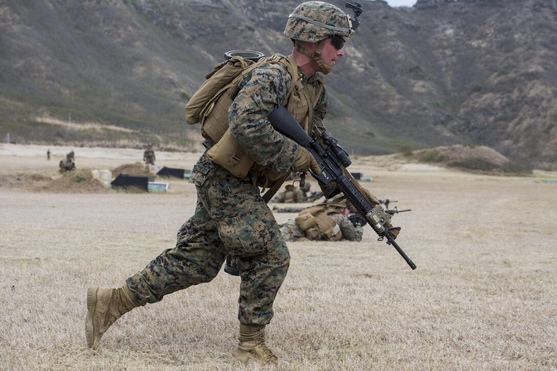 Lance Cpl. Robert Pugaczewski, a rifleman with Echo Company, 2nd Battalion, 3rd Marine Regiment, and a Glen Rock, Pa., native, combat glides during a squad attack training exercise at Kaneohe Bay Range Training Facility aboard Marine Corps Base Hawaii, April 21, 2016. The purpose of this exercise was to help team and squad leaders improve their combat assault capabilities as a cohesive unit with fire support from mortars and machine gun suppression. Echo Marines buddy-rushed targets, set up an ambush with a claymore and used rocket fire to suppress armored targets.