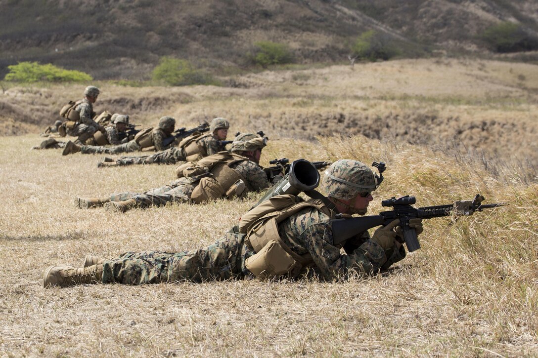 Marines with Echo Company, 2nd Battalion, 3rd Marine Regiment provide suppression fire during a squad attack exercise at Kaneohe Bay Range Training Facility aboard Marine Corps Base Hawaii, April 21, 2016. The purpose of this exercise was to help team and squad leaders improve their combat assault capabilities as a cohesive unit with fire support from mortars and machine gun suppression. Echo Marines buddy-rushed targets using live rounds, set up an ambush with a claymore and used rocket fire to suppress armored targets.
