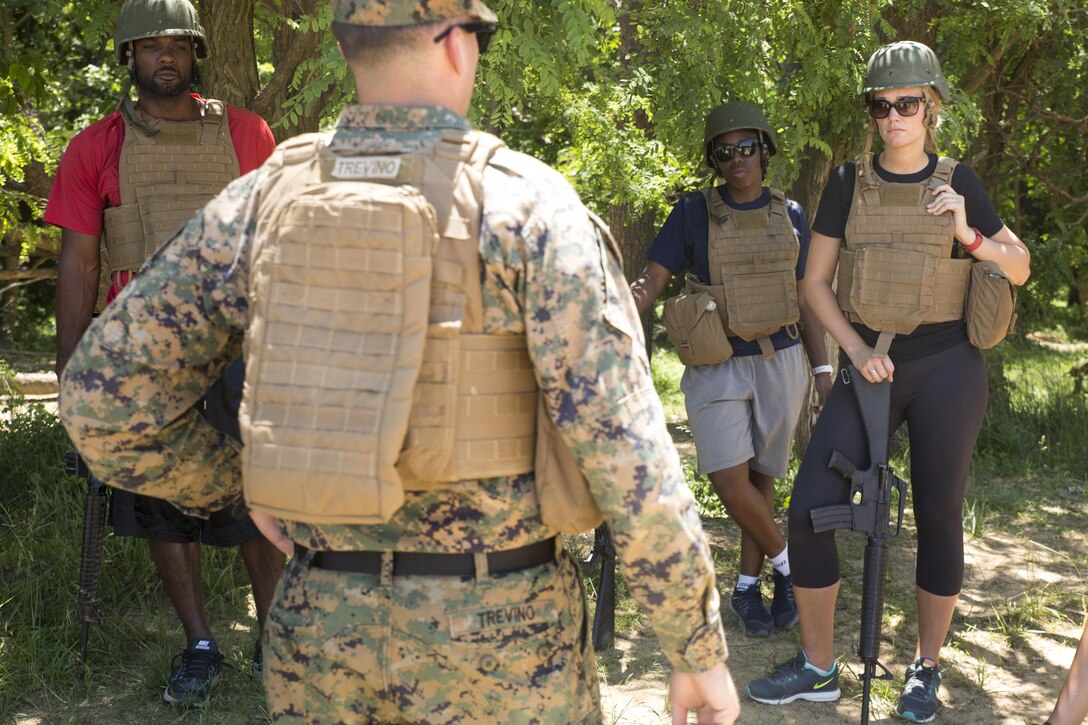 Jason Williams, left, Whitney Edwards and Margret Anderson learn different patrolling formations during the 2016 Key Leaders and Educators Workshop aboard Marine Corps Base Quantico, Va., June 9. Educators attend the Sunset Parade in Arlington, Va. and execute infantry patrols, flight simulations and more during the week-long workshop. Williams is the head women's basketball coach for Belmont Abbey College in Belmont, N.C. Edwards is a women's basketball assistant coach for the University of New Hampshire in Durham, New Hampshire. Anderson is an admissions counselor at Bob Jones University in Greenville, S.C.