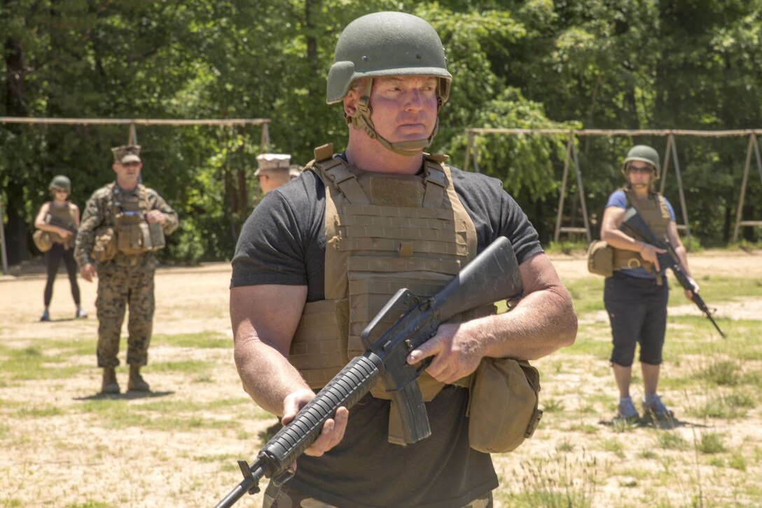 Timothy Donovan leads his squad in a patrol during the 2016 Key Leaders and Educators Workshop aboard Marine Corps Base Quantico, Va., June 9. The purpose of the workshop is to show educators the benefits of serving in the Marine Corps, enabling them to provide guidance based on firsthand experience to their students. Donovan is a paramedic instructor for the National Medical Education and Training Center in Bridgewater, Mass.