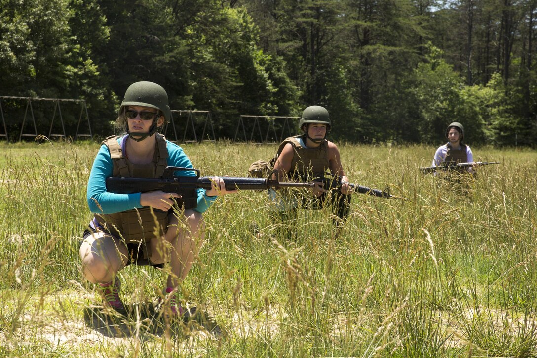 Jamie Chilton, Ph. D., provides security during the patrolling portion of the 2016 Key Leaders and Educators Workshop aboard Marine Corps Base Quantico, Va., June 9. The week-long workshop creates a mutually beneficial relationship between educators and the Marine Corps where key leaders and educators can share knowledge about the Corps with America’s leaders of tomorrow. Chilton is an adjunct instructor and career consultant from University of South Florida, Tampa, Fl.
