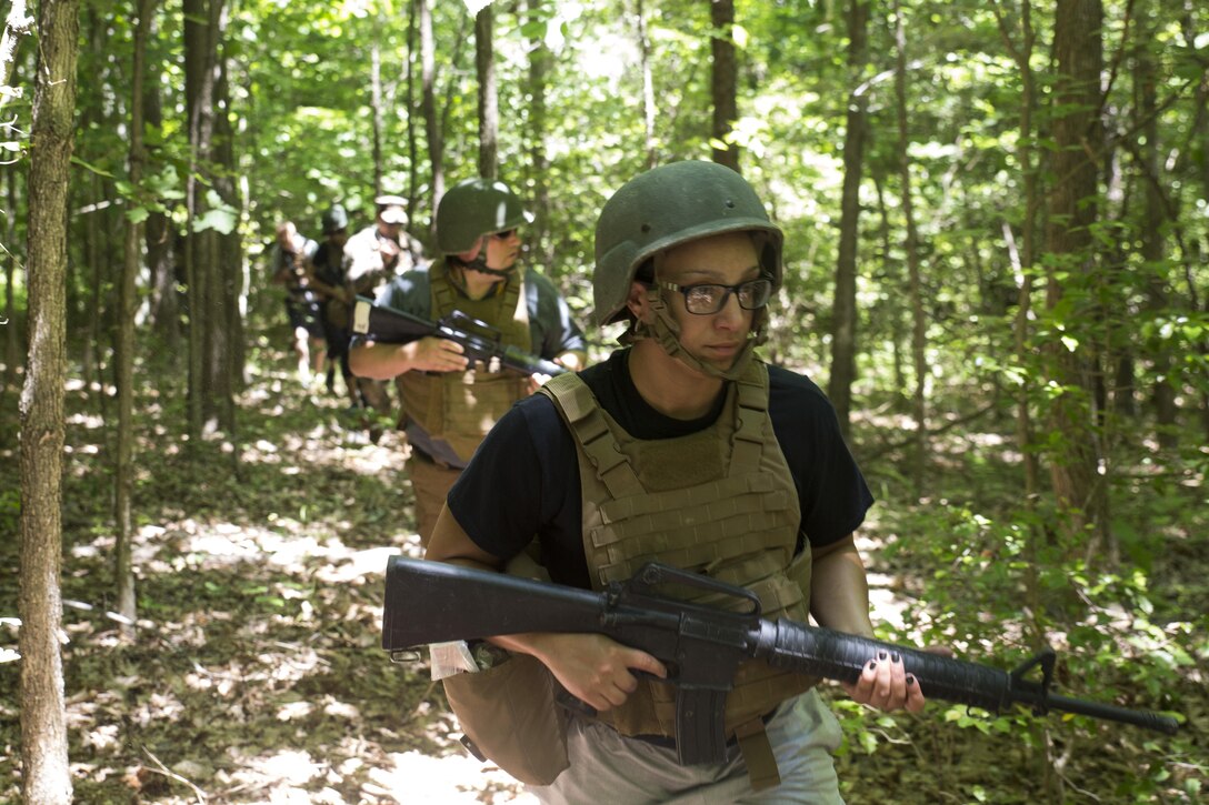 Ryenn Micaletti leads her squad in a patrol during the 2016 Key Leaders and Educators Workshop aboard Marine Corps Base Quantico, Va., June 9. The week-long workshop creates a mutually beneficial relationship between educators and the Marine Corps where key leaders and educators can share knowledge about the Corps with America's leaders of tomorrow. Micaletti is an assistant women's basketball coach for Slippery Rock University in Slippery Rock, Penn.