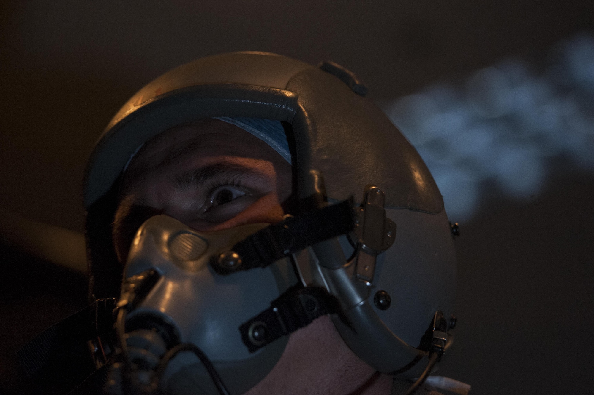 U.S. Air Force Tech. Sgt. Robert Watkins, 320th Special Tactics Squadron pararescueman, uses a Reduced Oxygen Breathing Device (ROBD) in a dark environment June 8, 2016, at Kadena Air Base, Japan. Hypoxia training can be utilized in both light and dark settings, to simulate a day-time or night-time scenario in which a parachutist might find themselves. (U.S. Air Force photo by Airman 1st Class Lynette M. Rolen)