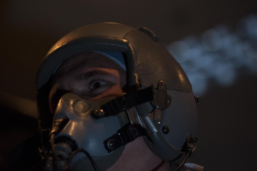 U.S. Air Force Tech. Sgt. Robert Watkins, 320th Special Tactics Squadron pararescueman, uses a Reduced Oxygen Breathing Device (ROBD) in a dark environment June 8, 2016, at Kadena Air Base, Japan. Hypoxia training can be utilized in both light and dark settings, to simulate a day-time or night-time scenario in which a parachutist might find themselves. (U.S. Air Force photo by Airman 1st Class Lynette M. Rolen)