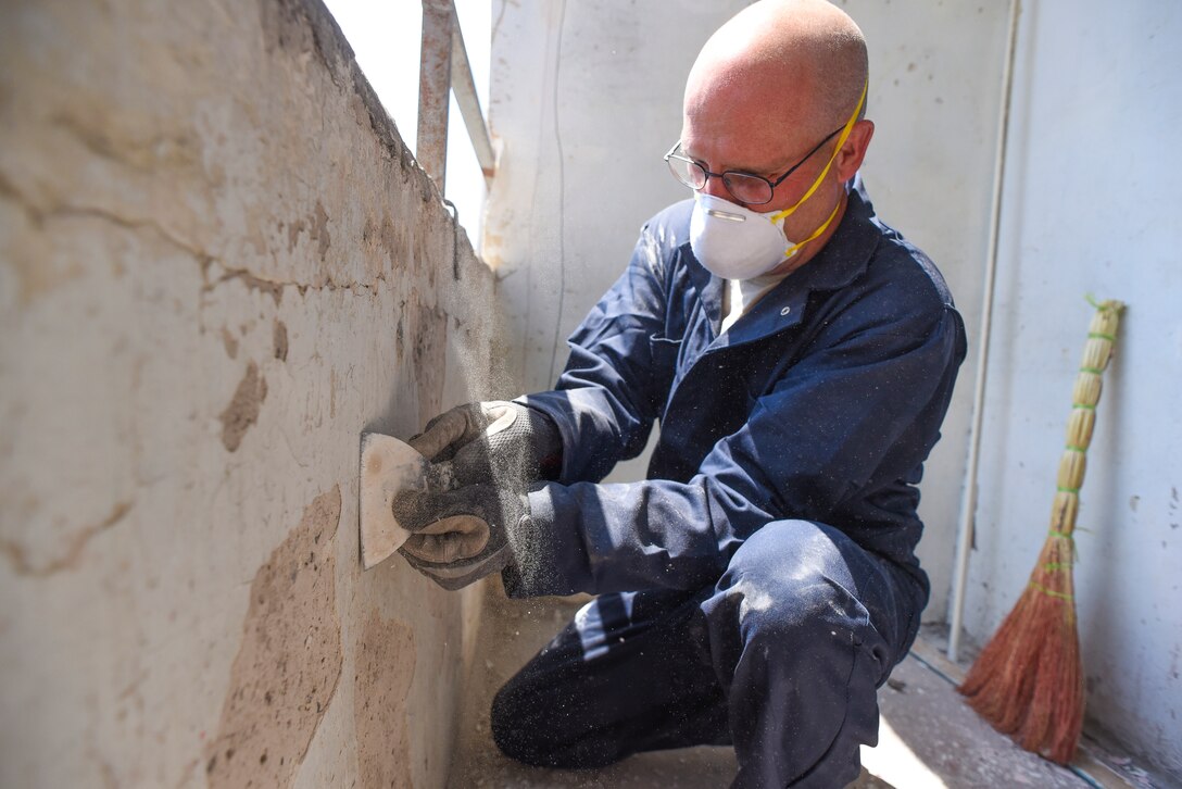 U.S. Air Force Staff Sgt. Dennis Tippens, a utilities craftsman with the 116th Civil Engineer Squadron, Georgia Air National Guard, scrapes paint off a balcony wall during a European Command Humanitarian Civic Assistance project in Yerevan, Armenia, May 11, 2016.   During the project, Airmen from the 116th Civil Engineer Squadron and the 461st Air Control Wing Staff worked in partnership with the Armenian people to renovate a Yerevan elderly institution.  The renovation provided crucial skill set training for the civil engineers while continuing the long-lasting friendship between the Armenian people and the citizens of the United States.  (U.S. Air National Guard photo by Master Sgt. Regina Young)