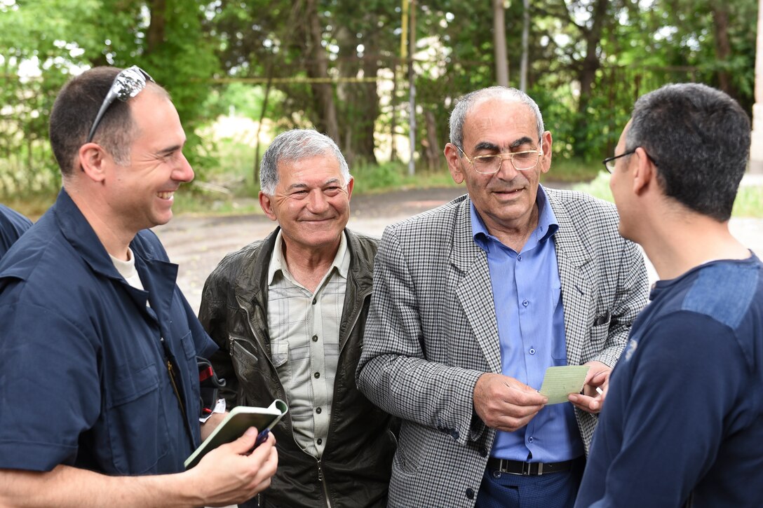 U.S. Air Force 2nd Lt. Chad Hypes, a project engineer from the 116th Civil Engineer Squadron, Georgia Air National Guard, shares a light-hearted moment with local Armenian contractors during a European Command Humanitarian Civic Assistance project in Yerevan, Armenia, May 16, 2016.   During the project, civil engineers from the 116th Civil Engineer Squadron and a structural craftsman from 461st Air Control Wing worked in partnership with the Armenian people to renovate a Yerevan elderly institution.  The renovation provided crucial skill-set training for the civil engineers while continuing the long-lasting friendship between the Armenian people and the citizens of the United States.  (U.S. Air National Guard photo by Master Sgt. Regina Young)

