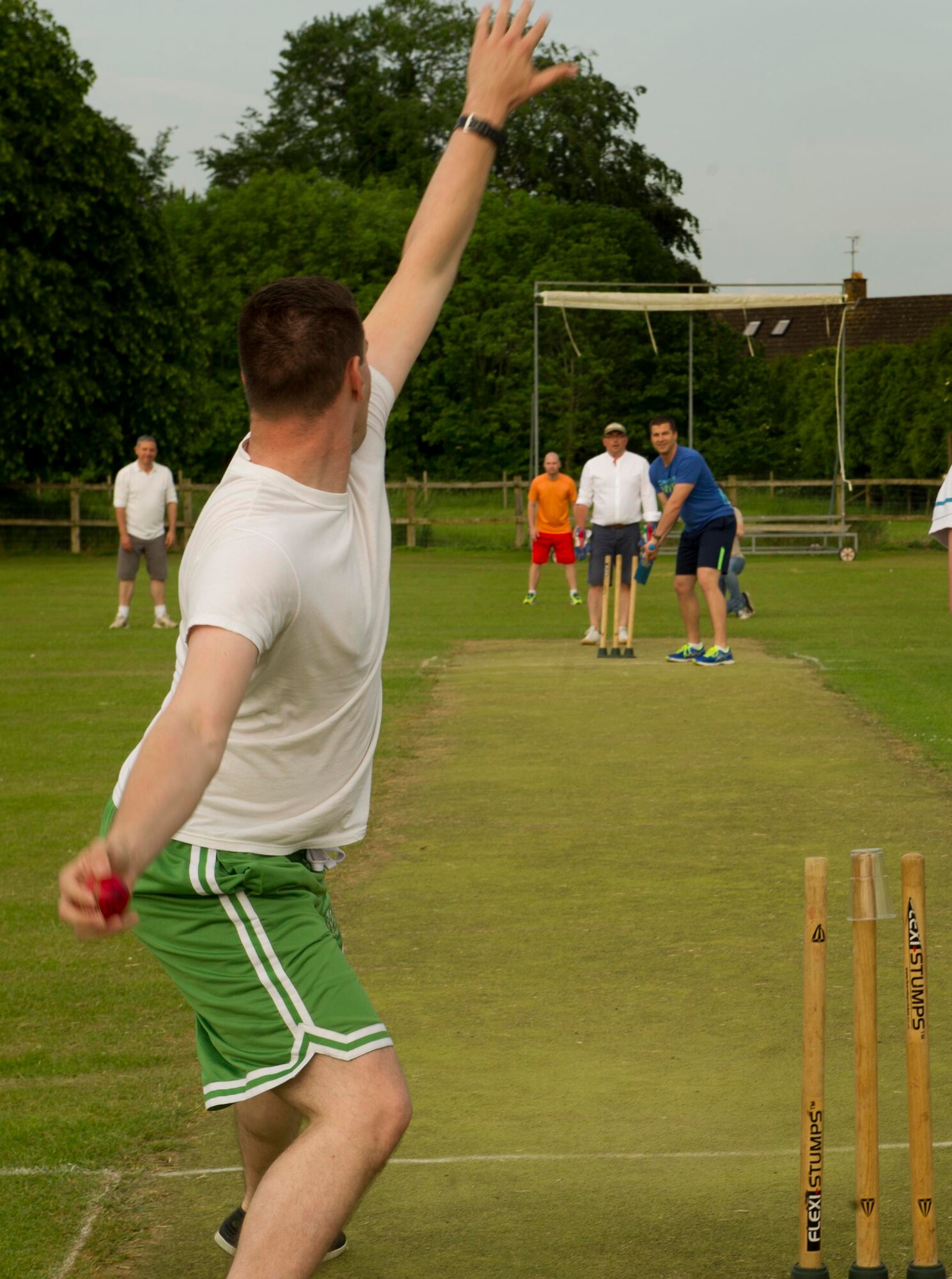 Capt. Kent Johnson, 23rd Expeditionary Bomb Squadron navigator, throws the ball during a game of cricket at the Fairford Cricket Club, June 8, 2016. The event was hosted by the RAF Fairford British-American Committee and consisted of cricket lessons followed by a match and barbecue. (U.S. Air Force photo/Senior Airman Sahara L. Fales)