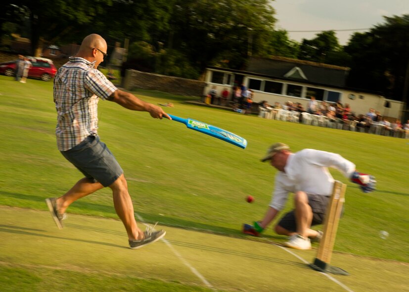 Tech. Sgt. Christopher Aflleje, 5th Expeditionary Aircraft Maintenance Squadron weapons expediter, races to ground his bat, scoring a run for his team at the Fairford Cricket Club, June 8, 2016. The RAF Fairford British-American Committee hosts a cricket game annually to bring together members from the base and the local area to maintain community relations. (U.S. Air Force photo/Senior Airman Sahara L. Fales)