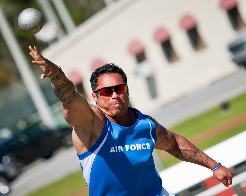 Tech. Sgt. Christopher Ferrell, 11th Civil Engineer Squadron explosive ordnance disposal technician, releases his toss during an afternoon track and field session at the Air Force team’s training camp at Eglin Air Force Base, Fla., April 5, 2016. Ferrell is an Air Force Wounded Warrior and will compete at the Department of Defense 2016 Warrior Games June 16-21, 2016. (U.S. Air Force photo by Samuel King Jr.)