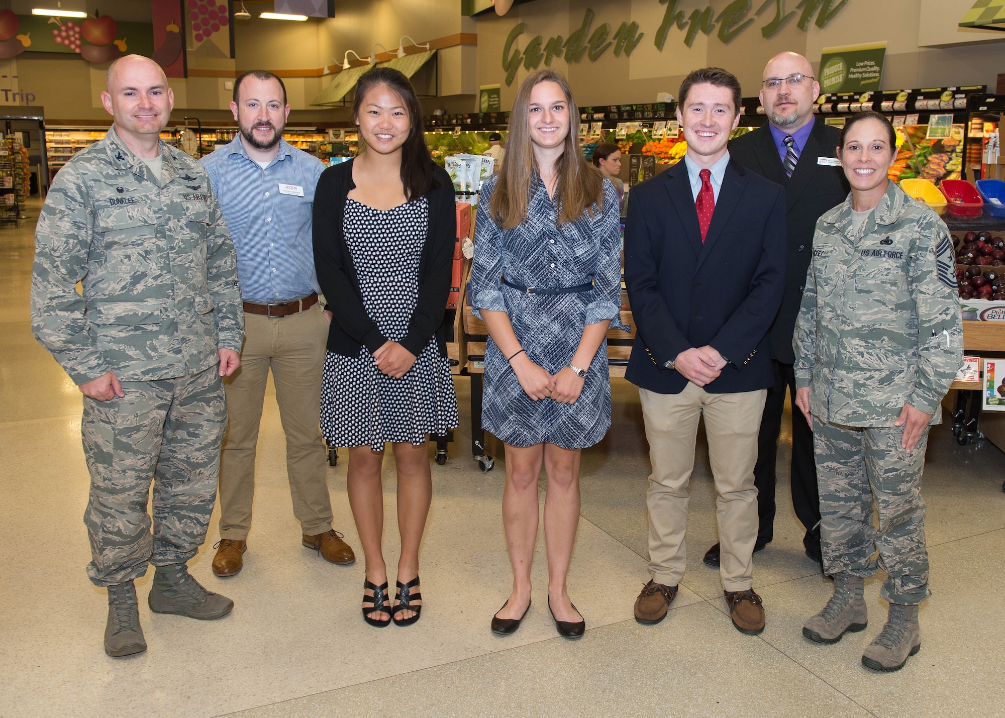 Col. David R. Dunklee, left, 66th Air Base Group commander, and Hanscom Command Chief Master Sgt. Patricia A. Hickey, right, stand with scholarship recipients at the Hanscom Air Force Base, Mass., Commissary June 8. The following students were presented $2,000 scholarships as part of the Scholarships for Military Children Program run by the Defense Commissary Agency; Julia Balukonis, left, from Hudson N.H.; Kalia Bavin from Wilmington, Mass.; Kevin Coakley, right, from Duxbury Mass,; (not pictured) Sawyer Krueger from Hanscom AFB; Aubrey Leary, center, from Worcester Mass,; Makenzie Roberts from Williston Vt.; and Alexis Sprowl from Lowell Mass. Also pictured is Brandon Labrecque, second from left, a senior sales representative from Acosta, who sponsored the scholarships, and Sean Farrell, second from right, the Hanscom Commissary store manager. (U.S. Air Force photo by Jerry Saslav)