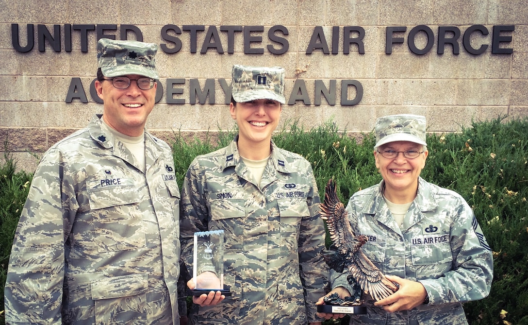Lt Col Dan Price, Capt Shanti Simon, and CMSgt Gail Tucker pictured with the USAFA Falcon Team Award for the 3rd Quarter of 2015.