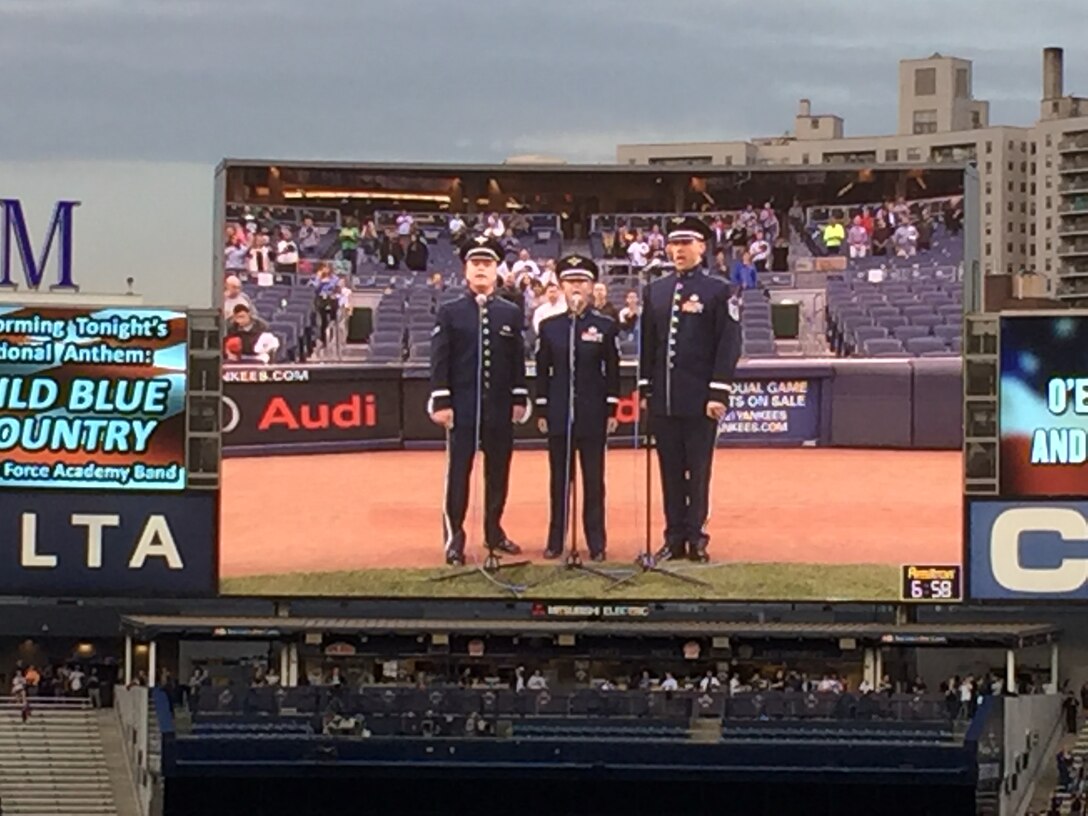 The USAF Academy Band's Wild Blue Country singing the national anthem for the NY Yankees/Oakland A's game!  Pictured left to right: A1C Jamie Teachenor, TSgt Krista Joyce, and MSgt Jeff Valentine.