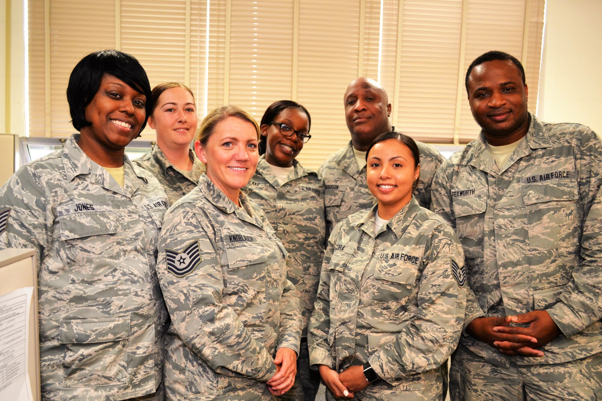 Members of the 111th Force Support Squadron Customer Service Office stand for a picture at Horsham Air Guard Station, Pa., June 8, 2016. Members of an Air National Guard wing customer service office provide cradle-to-grave administrative services for not only all military branches, but also military retirees and dependents. (U.S. Air National Guard photo by Tech. Sgt. Andria Allmond)